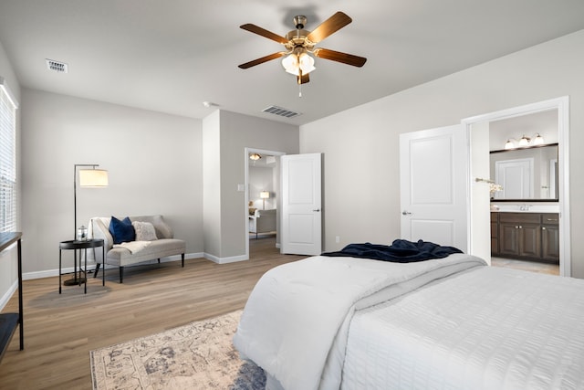 bedroom with light wood-style flooring, baseboards, and visible vents