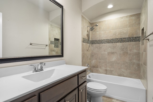 bathroom featuring bathing tub / shower combination, toilet, and vanity