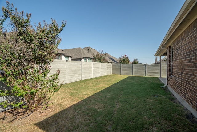 view of yard with a fenced backyard