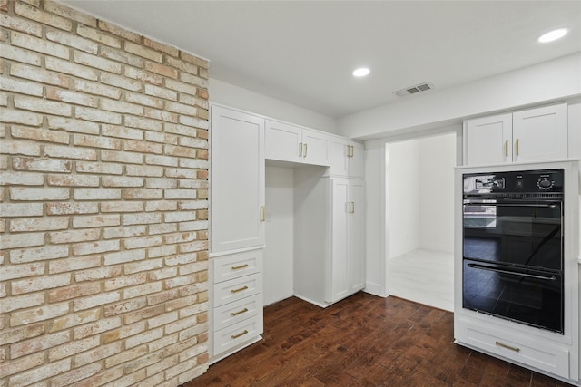 kitchen with visible vents, dark wood finished floors, recessed lighting, white cabinets, and dobule oven black