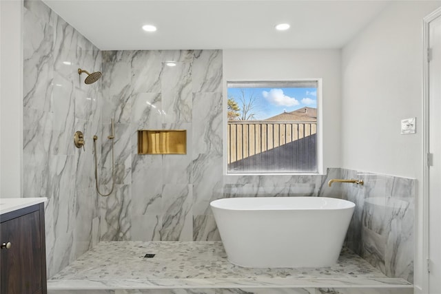 full bathroom featuring vanity, a soaking tub, recessed lighting, and a marble finish shower