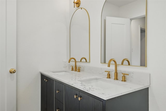 full bath featuring double vanity and a sink