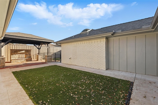 view of yard featuring a gazebo and fence