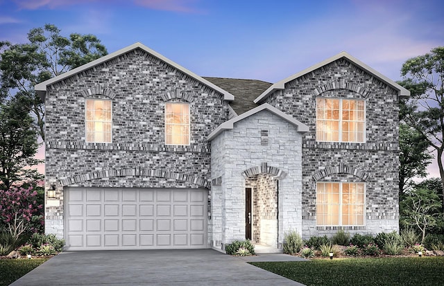 french country style house featuring a garage and driveway