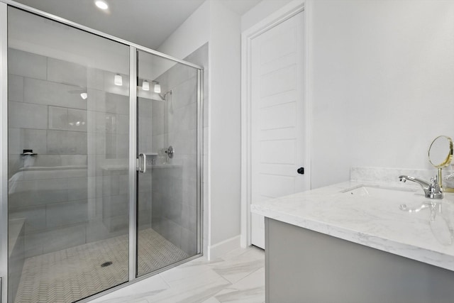 full bathroom featuring vanity, marble finish floor, and a shower stall