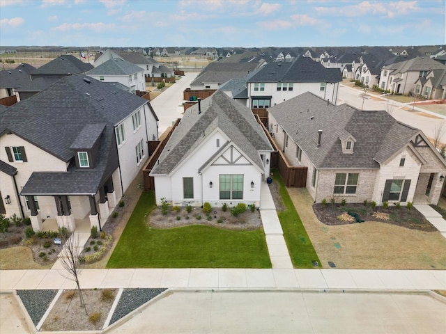 birds eye view of property with a residential view