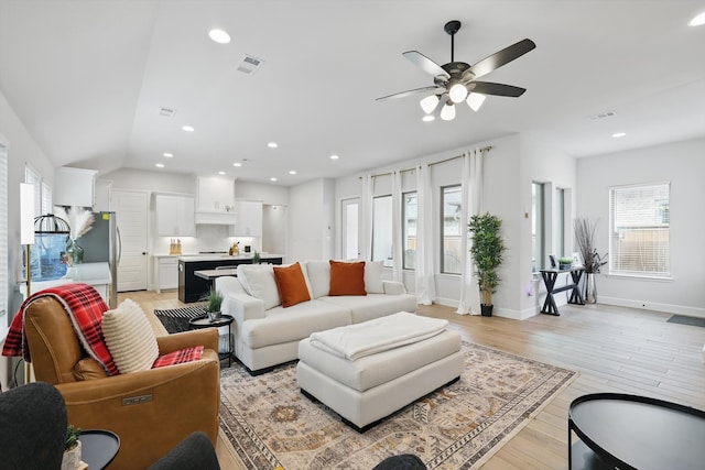 living room with visible vents, recessed lighting, light wood-style floors, and ceiling fan