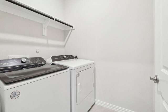 full bathroom with double vanity, baseboards, visible vents, and a sink