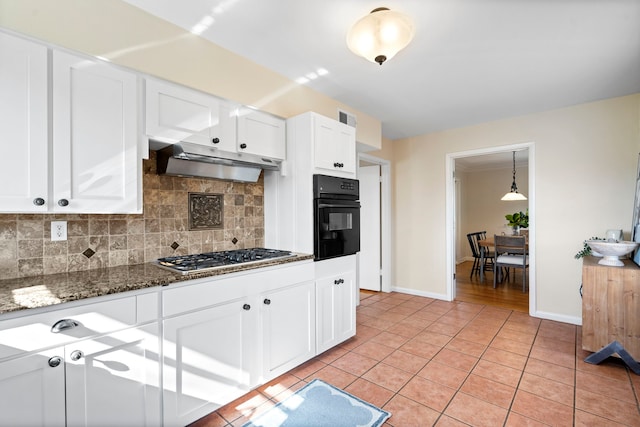 kitchen with oven, visible vents, under cabinet range hood, stainless steel gas stovetop, and light tile patterned flooring