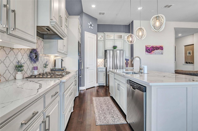 kitchen featuring dark wood-style flooring, visible vents, appliances with stainless steel finishes, and a sink