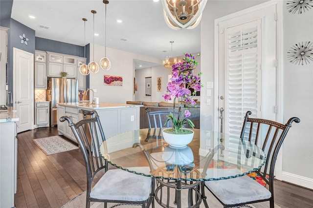 dining room with visible vents, baseboards, recessed lighting, an inviting chandelier, and dark wood-style floors