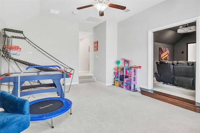 recreation room with baseboards, visible vents, ceiling fan, vaulted ceiling, and carpet flooring