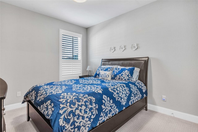 bedroom featuring carpet flooring and baseboards