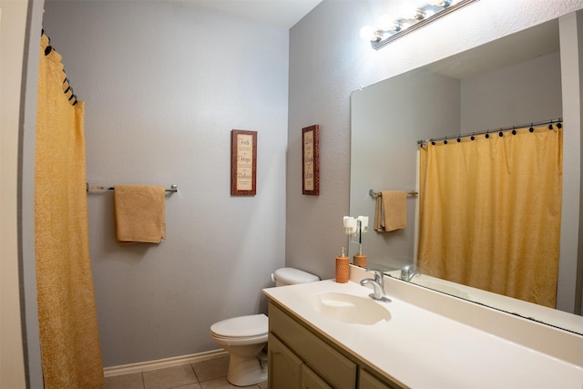 full bathroom featuring baseboards, toilet, vanity, and tile patterned flooring