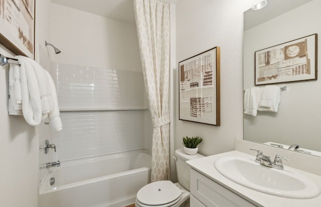 full bath with vanity, toilet, and shower / tub combo