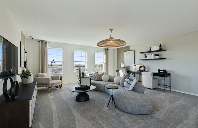 living room with carpet flooring and baseboards