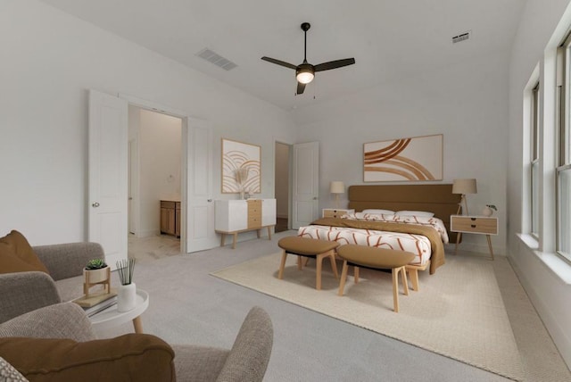 carpeted bedroom featuring visible vents and a ceiling fan