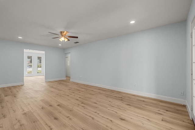 empty room featuring visible vents, a ceiling fan, recessed lighting, light wood-style floors, and baseboards