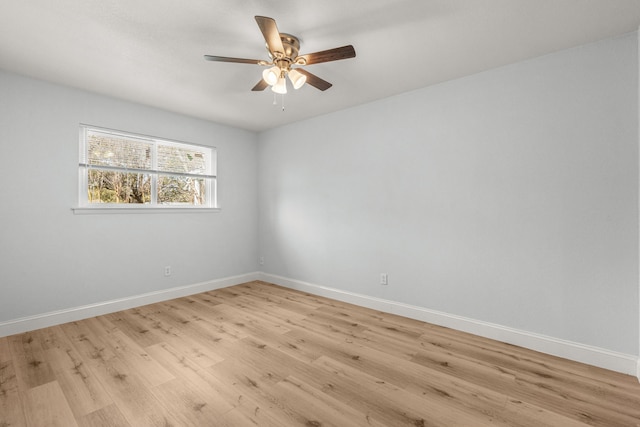 unfurnished room featuring baseboards, ceiling fan, and light wood finished floors