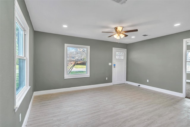 interior space featuring wood finished floors, recessed lighting, a ceiling fan, and baseboards