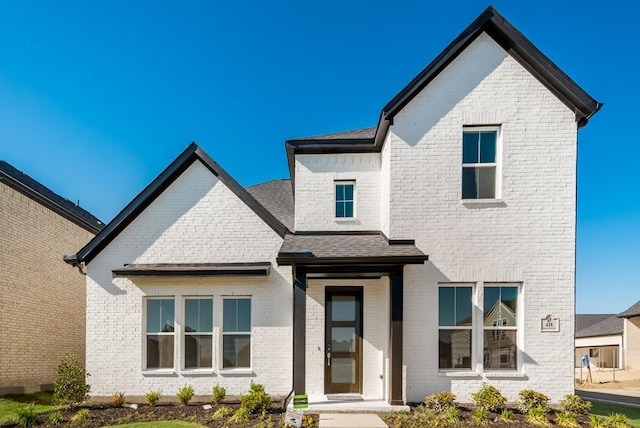 view of front of house with brick siding