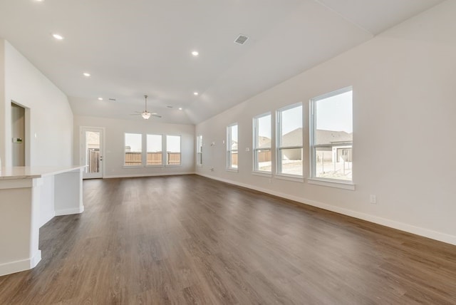 unfurnished living room featuring baseboards, vaulted ceiling, recessed lighting, dark wood-style floors, and a ceiling fan