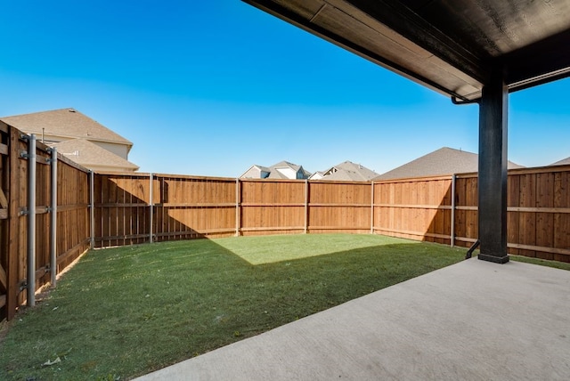 view of yard featuring a patio and a fenced backyard