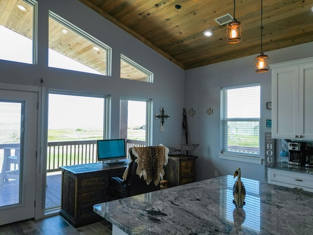 dining room with wood finished floors, visible vents, lofted ceiling, and wooden ceiling