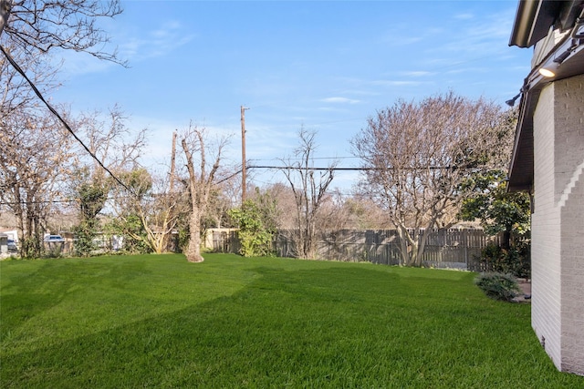 view of yard with fence