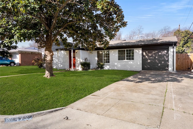 single story home featuring brick siding, driveway, an attached garage, and a front yard