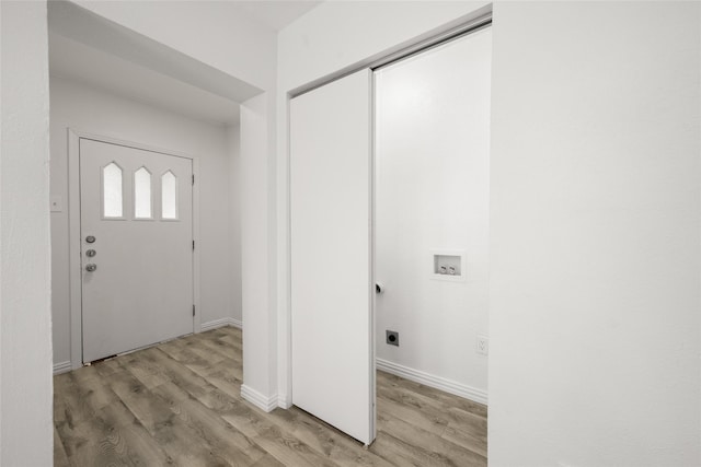 entrance foyer with light wood-style floors