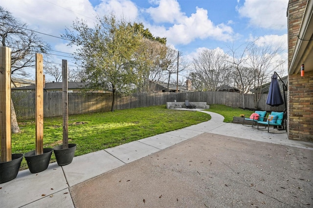 view of yard with a patio area and a fenced backyard