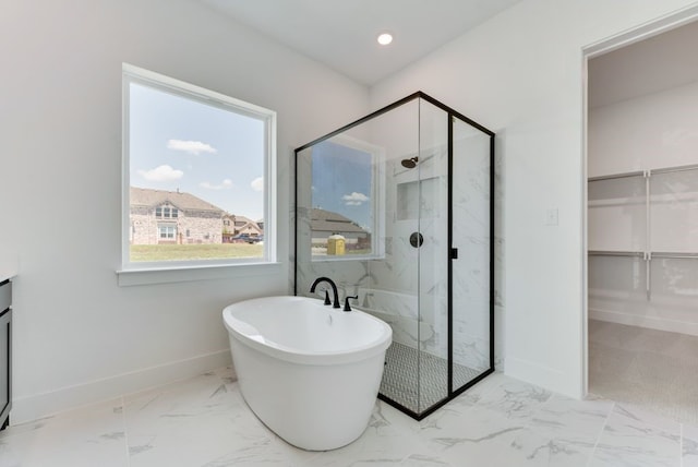 full bathroom with a marble finish shower, baseboards, recessed lighting, a freestanding tub, and marble finish floor