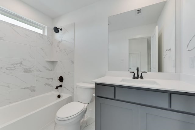 bathroom with shower / bathing tub combination, toilet, visible vents, and vanity