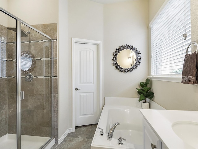 bathroom featuring vanity, a shower stall, and a bath