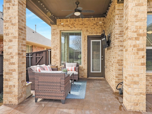 view of patio with outdoor lounge area and a ceiling fan