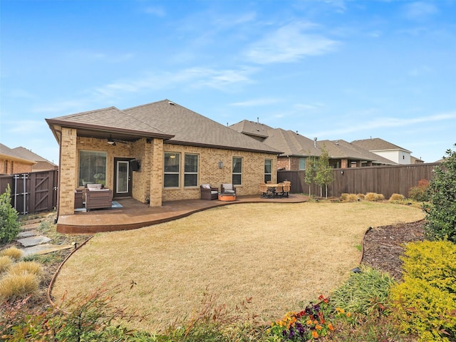 back of house with a patio, fence, brick siding, and a shingled roof