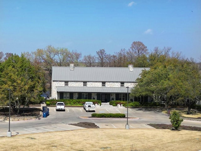 view of building exterior featuring uncovered parking