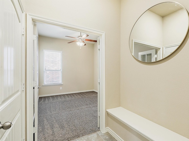 bathroom featuring baseboards and a ceiling fan