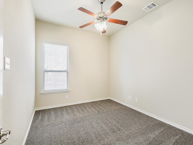 spare room with visible vents, baseboards, carpet, and a ceiling fan