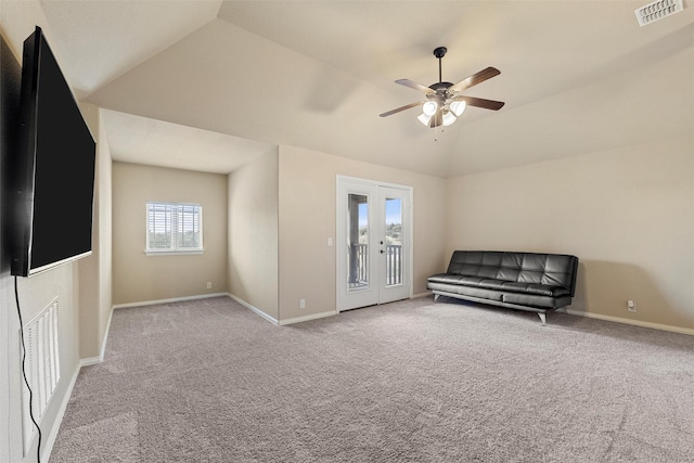 unfurnished room with visible vents, carpet flooring, baseboards, ceiling fan, and vaulted ceiling