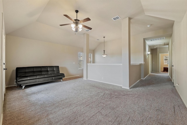 unfurnished room featuring attic access, a ceiling fan, visible vents, and lofted ceiling