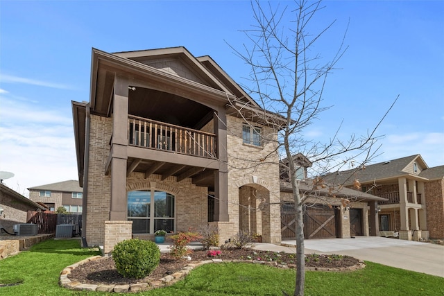 view of front facade with brick siding, an attached garage, central AC unit, a balcony, and driveway