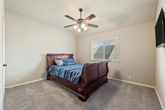 carpeted bedroom with baseboards, ceiling fan, and vaulted ceiling