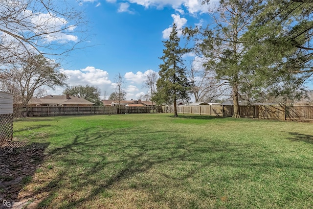 view of yard featuring a fenced backyard