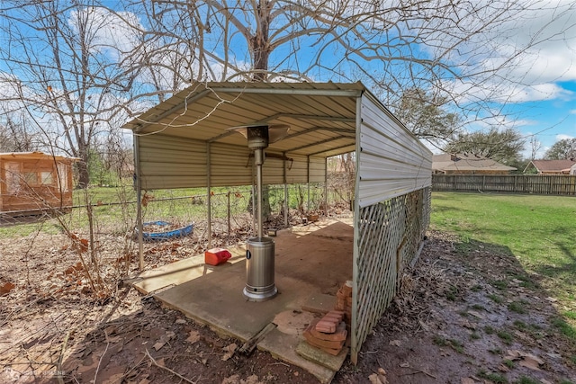 view of outbuilding featuring fence