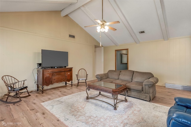 living room with beamed ceiling, wood finished floors, visible vents, and ceiling fan