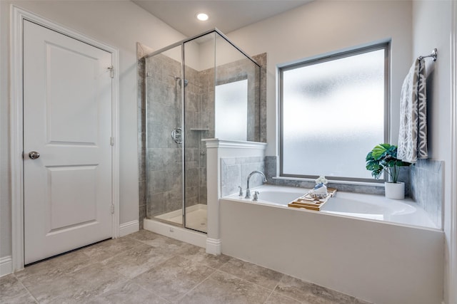 full bath featuring a bath and a shower stall