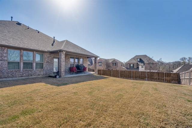 view of yard featuring a patio and fence