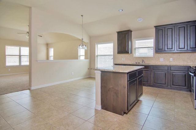 kitchen with light tile patterned floors, lofted ceiling, and a ceiling fan